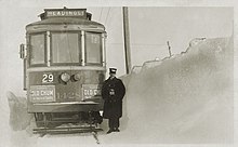 Suburban Rapid Transit Co. interurban in Headingley, Manitoba. Note the antiquated spelling of "Headingly" on the train. Headingley Interurban (ca. 1927).jpg