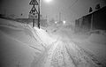 Black & White Image of Snow covered A6024 Woodhead Road, into Holme Village, from Holme Moss in the Dark Peak area of The Peak District National Park, During the Winter of 1978