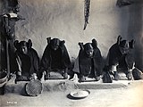 Four young Hopi women grinding grain, c. 1906, photo by Edward S. Curtis