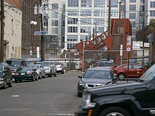 The neighborhood separated by PATH tracks crossed by a pedestrian bridge Marion, Jersey City bridge over PATH.jpg