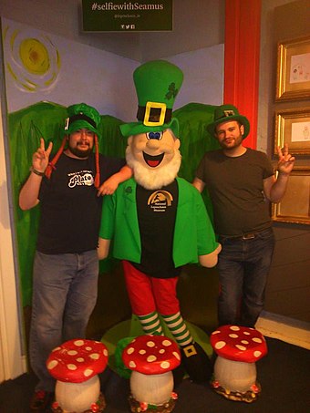 Tourists with a novelty oversized Leprechaun in Dublin