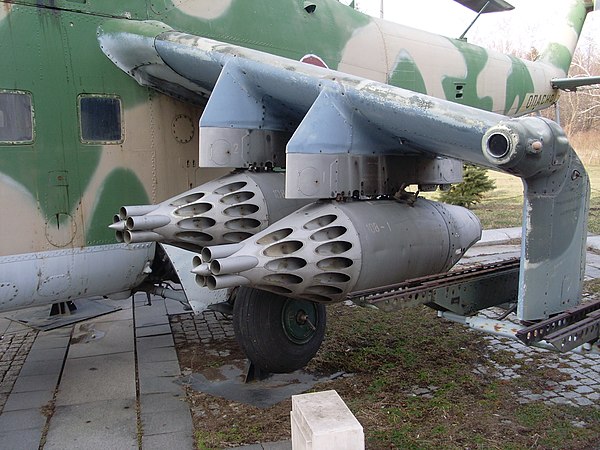 A pair of UB-32 pods under the wingtip of a Mil Mi-24 helicopter.