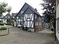 3 half-timbered houses built in and next to each other from different times