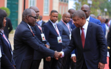 Nicolas Kazadi (left), Angolan President Joao Lourenco (right), and Congolese President Felix Tshisekedi (behind) 2019. Nicolas Kazadi Angola.png