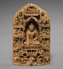 Small stone group from Bihar, 11th-12th century, 8.2 x 6.1 cm (3 1/4 x 2 3/8 in.), apparently taken back to Nepal by a pilgrim. Northern India, Bihar, 11th-12th century - Buddha Calling the Earth to Witness - 1965.27 - Cleveland Museum of Art (cropped).tif