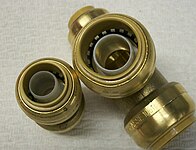 A push-in compression coupling and tee. PEX compression connectors.jpg