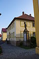 This is a picture of the Bavarian Baudenkmal (cultural heritage monument) with the ID D-6-78-193-62 (Wikidata) Camera location 49° 56′ 39.84″ N, 10° 04′ 33.89″ E  View all coordinates using: OpenStreetMap Deutsch: Ehem. Pfarrhaus, zweigeschossiger, verputzter Walmdachbau, bezeichnet 1810. Kirchgasse 2, Eßleben, Markt Werneck, Unterfranken, Deutschland