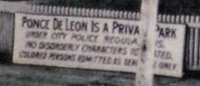 A sign at the entrance to Ponce de Leon amusement park in 1908 indicating "colored persons admitted as servants only" Ponce de leon springs segregation.jpg