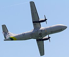 The ATR 42 has a straight wing with a 11.1 wing aspect ratio, and retractable landing gear in fairings under the fuselage, with wheel sides visible in flight.