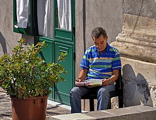 Reading Taking in the meaning of letters or symbols