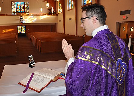 An American military chaplain prepares for a live-streamed liturgy in an empty chapel at Offutt Air Force Base in March 2020