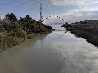 The Ryder Park pedestrian bridge is the last crossing of San Mateo Creek before it flows into the Bay. Ryder Park, San Mateo (42349327490).jpg