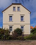 Residential house with farm and coach house at the rear