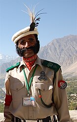 Pakistani security officer sporting a clipped moustache