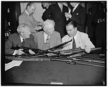 Senator Sheppard, left, Chairman of the Senate Military Affairs Committee, Maj. Gen. George A. Lynch, U.S. Chief of Infantry, and Senator A. B. Chandler of Kentucky, inspect the M1941 semi-automatic rifle which competed unsuccessfully against the M1 Garand to become the Army's standard weapon Senators Inspect Johnson Rifle.jpg