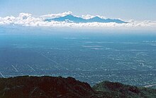 View of the Santa Rita Mountains across the Tucson valley from the Santa Catalina Mountains. The Santa Ritas are among the most prominent of the "sky islands" in southern Arizona. SkyIslands from SantaCatalinaMtns.JPG