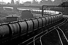 An empty coal train heads west through Maitland bound for the coal mines Snaking.jpg