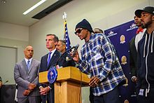 Snoop Dogg and Los Angeles Mayor Eric Garcetti speaking at a press conference following the 2016 shooting of Dallas police officers