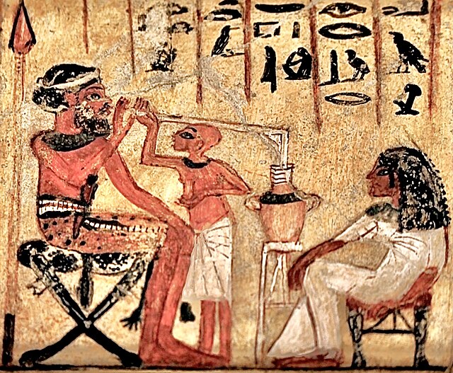 Ancient Egyptian painting, 18th dynasty, reign of Akhenaten, c. 1300 BC, showing Syrian mercenary drinking beer through a straw. Egyptian Museum of Be