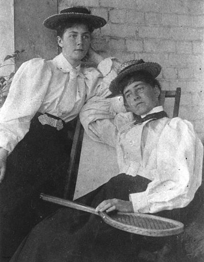 StateLibQld 1 42023 Two women dressed for a game of tennis, 1890-1900.jpg