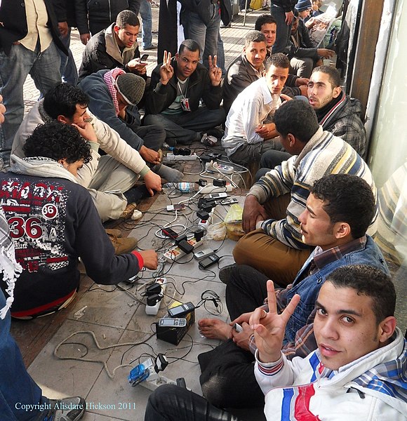 File:Tahrir Square - Protesters Charging Mobile Phones (6620193705).jpg