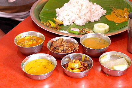 Manipuri lunch means white rice, vegetable curry, cucumbers, groundnut gravy and onions.