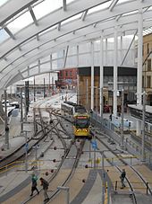 A tram entering Victoria from the city-centre streets. Tram entering Manchester Victoria.JPG