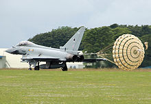 RAF Typhoon using a drogue parachute for extra braking after landing Typhoon deploying parachute arp.jpg