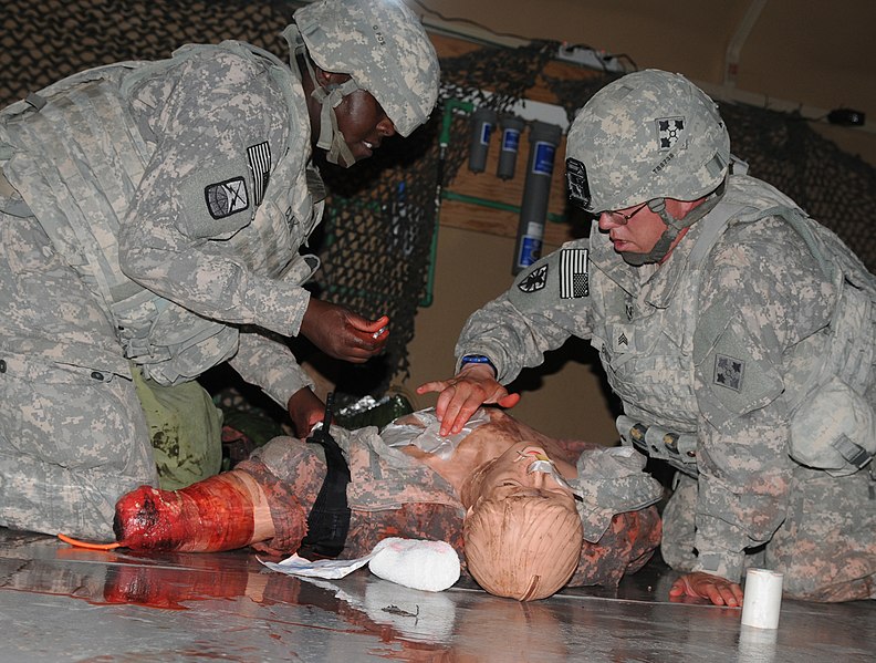 File:U.S. Army Sgt. Travis Bayne, right, an ammunition stock control and accounting specialist, and Spc. April Clark, an information technology specialist, with Headquarters and Headquarters Company, 4th Brigade 130618-A-YY130-301.jpg