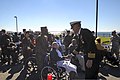 U.S. Navy Capt. Karl O. Thomas, right foreground, the commanding officer of the aircraft carrier USS Abraham Lincoln (CVN 72), speaks with an attendee during a Veterans Day ceremony Nov. 8, 2013, at the Hampton 131108-N-XP477-269.jpg