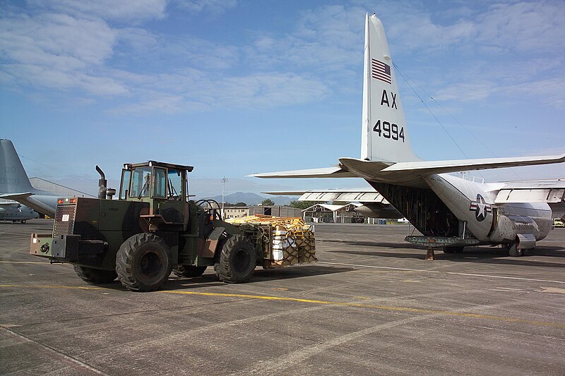 File:US Navy 040229-N-8055R-001 A U.S. Navy C-130T Hercules assigned to the "Capital Express" of Fleet Logistic Squadron Five Three (VR-53) takes on fresh food for U.S. Forces.jpg