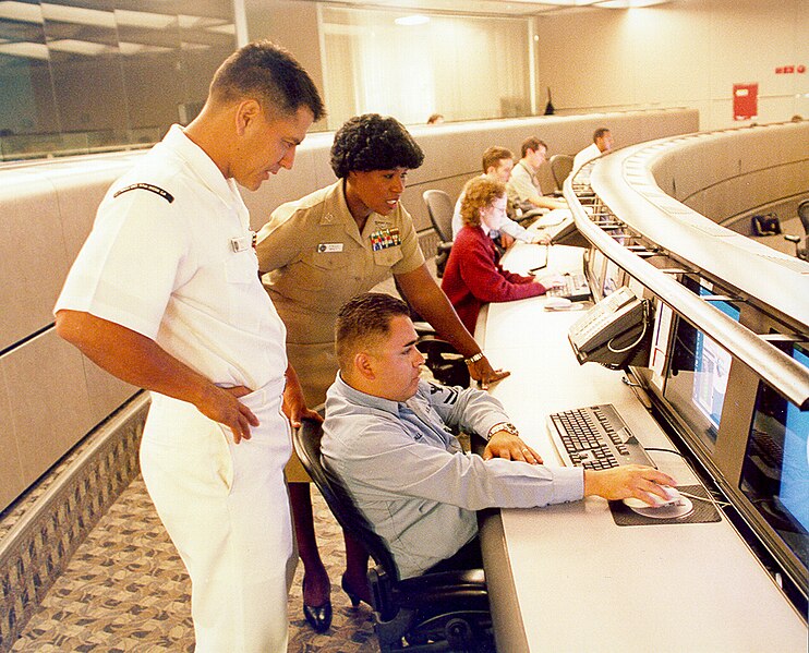 File:US Navy 040614-N-7952W-001 Information Systems Technician 1st Class Thomas Dull, left, Lt. Stella Nealy, center, and Information Systems Technician 2nd Class Eduardo Pallanes study a computer monitor at Naval Network and Space.jpg