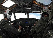The cockpit of an E-2C Hawkeye of United States Navy VAW-115. US Navy 081111-N-9565D-035 Lt. j.g. Doug Fitzpatrick, left, and Lt. Cmdr. Brian Beck conduct airborne early warning and strike group coordination.jpg