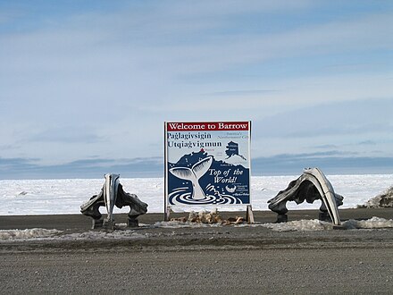 English ("Welcome to Barrow") and Iñupiaq (Paġlagivsigiñ Utqiaġvigmun), Utqiaġvik, Alaska, framed by whale jawbones