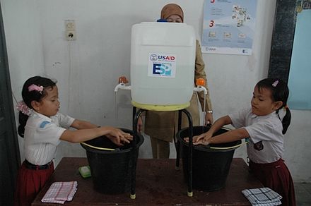 Pupils in Medan, Indonesia, practice handwashing in class