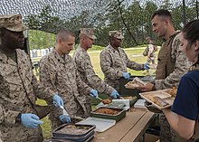 Marines serving UGR-Ms during a family career awareness event 1st Battalion, 10th Marine Regiment's Jane Wayne Day 140606-M-SO289-162.jpg