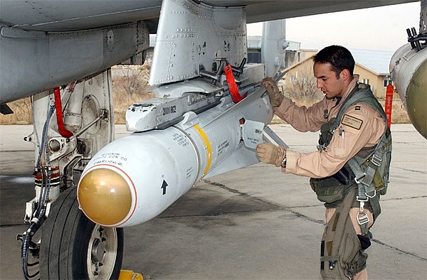 A pilot inspects an AGM-65 Maverick missile on his A-10 Thunderbolt II.