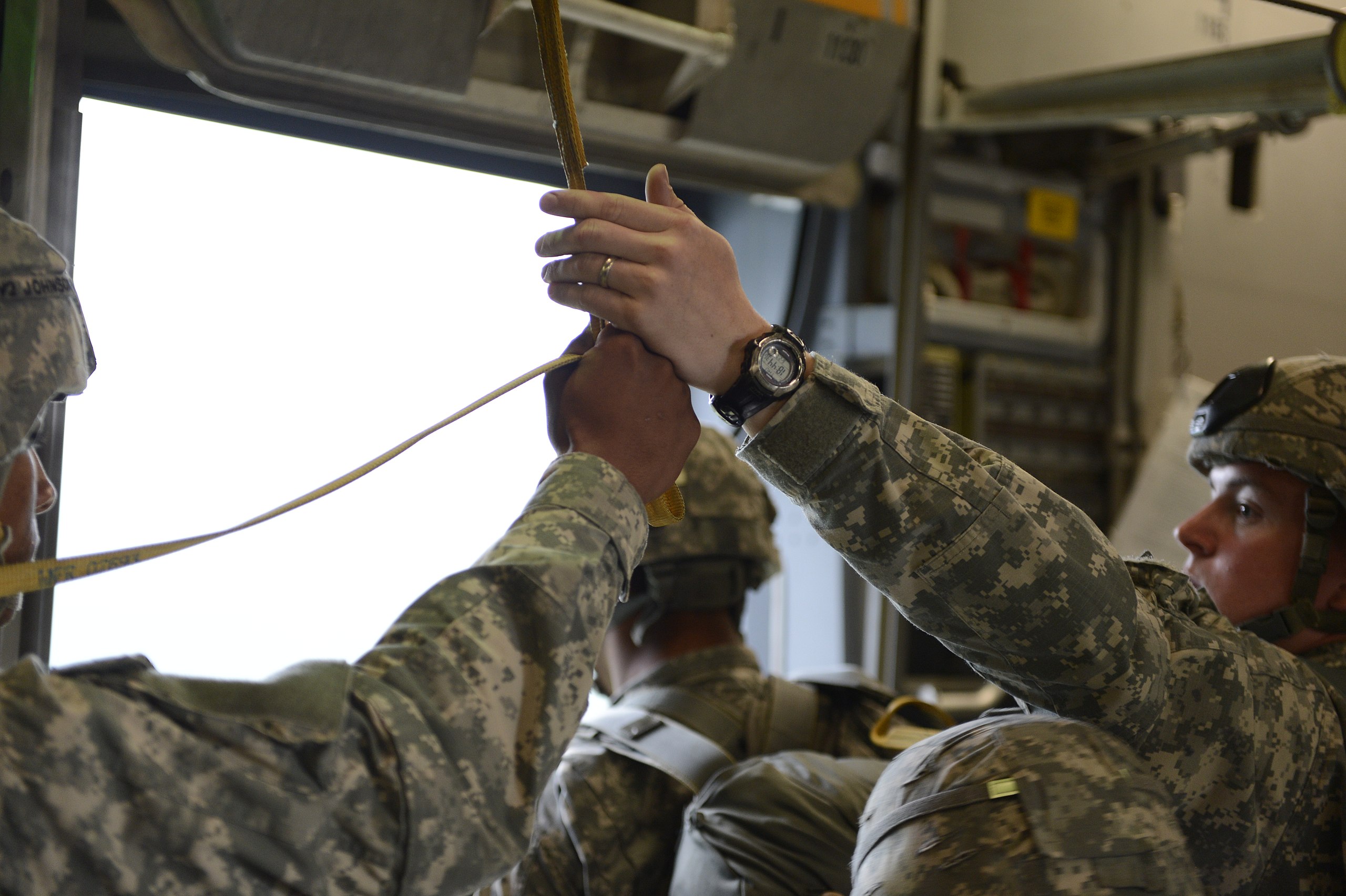File:A U.S. Army jumpmaster safety grabs the static line of a