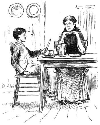 boy and woman talking across supper table