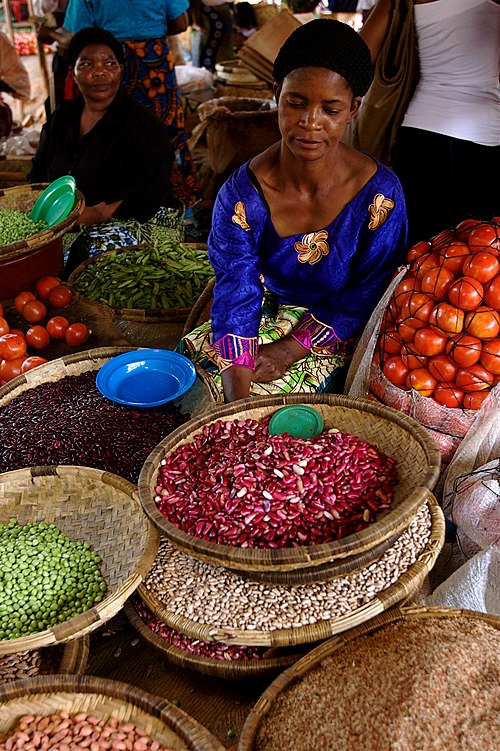 A woman selling produce at a market in Lilongwe, Malawi