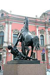 A horse tamer on the Anichkov Bridge, designed by Peter Clodt von Jurgensburg, near the Beloselsky-Belozersky Palace Anichkov bridge horse tamer 3.jpg