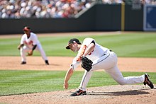 Chad Bradford delivers a pitch with a submarine motion. Bradford delivery.jpg