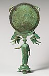 Bronze mirror with a support in the form of a draped woman MET DP266227 (cropped).jpg