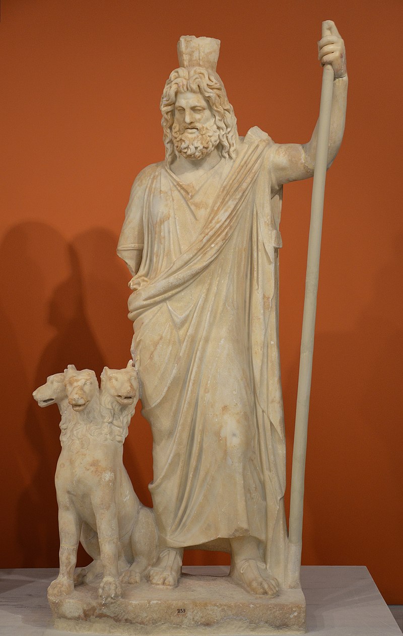 https://upload.wikimedia.org/wikipedia/commons/thumb/a/a1/Detail_of_Pluto-Serapis%2C_Statue_group_of_Persephone_%28as_Isis%29_and_Pluto_%28as_Serapis%29%2C_from_the_Sanctuary_of_the_Egyptian_Gods_at_Gortyna%2C_mid-2nd_century_AD%2C_Heraklion_Archaeological_Museum_%2830305313721%29.jpg/800px-thumbnail.jpg
