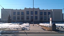 Fairbanks' Patrick Cole City Hall, originally constructed in 1934 as a school building, replacing a wooden structure which burned down. Known colloquially as "Old Main", the building housed classrooms until the mid-1970s. Fairbanks North Star Borough School District administrative offices occupied the building until the city government took it over in 1995. Fairbanks Alaska City Hall.jpg