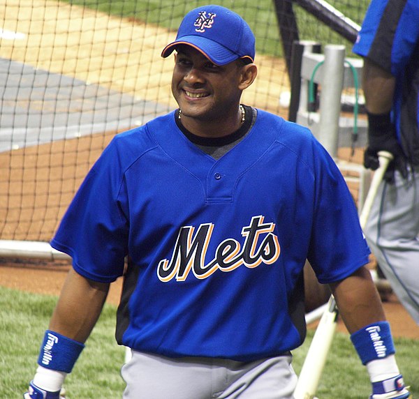 Fernando Tatís (pictured with the Mets) is the only player to hit two grand slams in the same inning, with the Cardinals, in 1999.