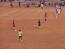 Before a football match in a village in Cameroon Foot groups.jpg