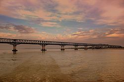 IRRAWADDY FERRY JOURNEY RAILWAY BRIDGE NEAR BAGAN STEAMING TO MANDALAY MYANMA FEB2013.jpg