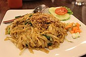 Kwetiau goreng served with acar pickles and fried shallot sprinkles. Indonesian fried kwetiau.JPG