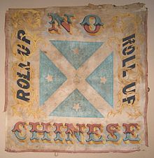 The Roll Up banner around which a mob of about 1,000 men rallied and attacked Chinese miners at Lambing Flat in June 1861. The banner is now on display in the museum at Young. LambingFlatRollUpBanner reworked.jpg